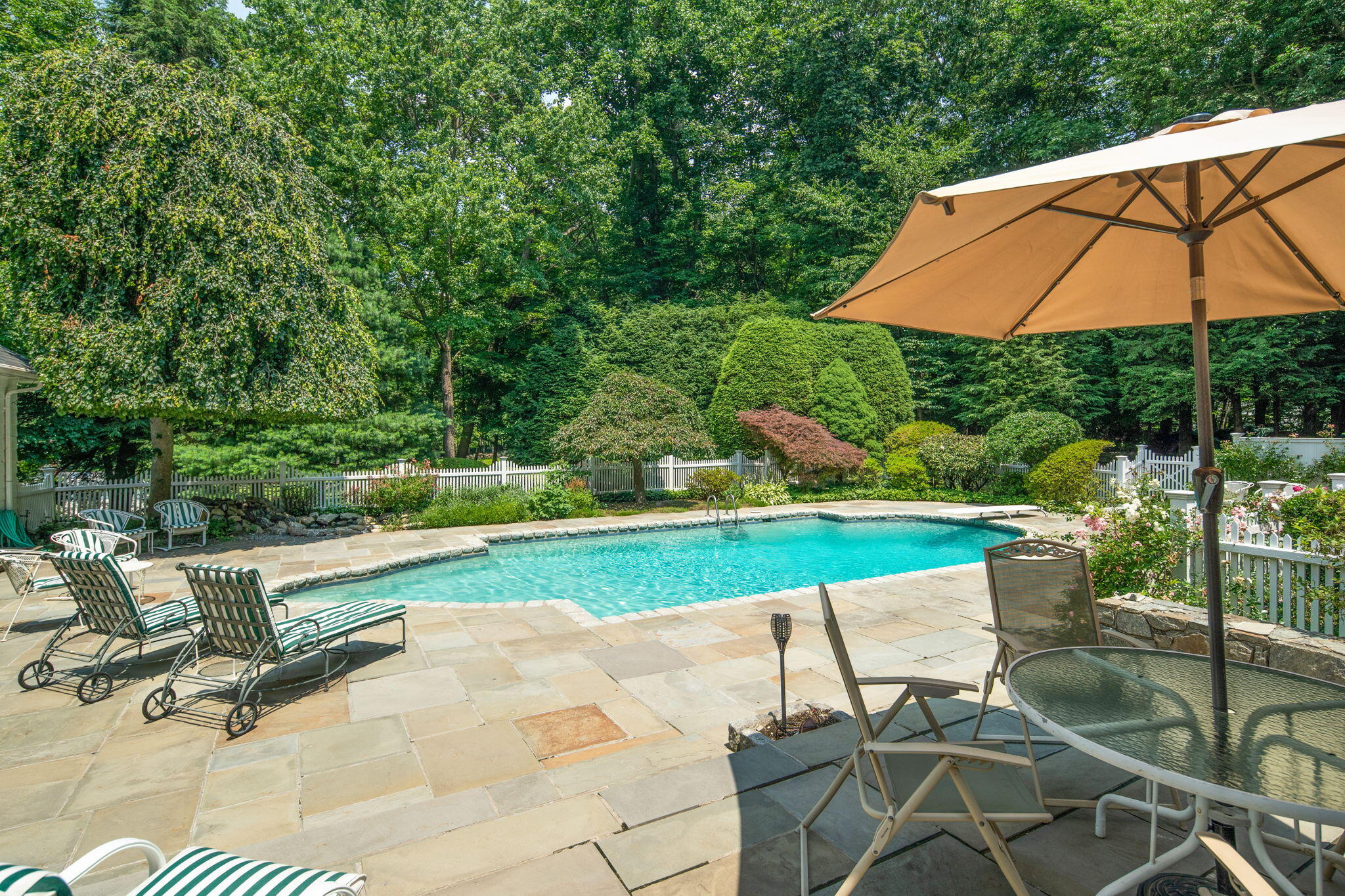 2061 Ponus Ridge Road New Canaan, CT 06840 - Photo 20 of 50 a view of backyard with outdoor seating and green space