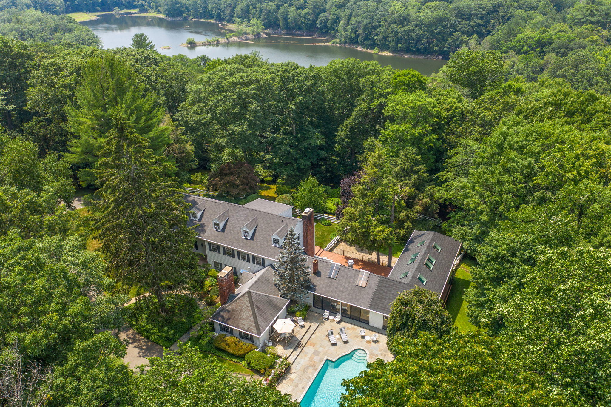 2061 Ponus Ridge Road New Canaan, CT 06840 - Photo 3 of 50 an aerial view of residential house with outdoor space and trees all around