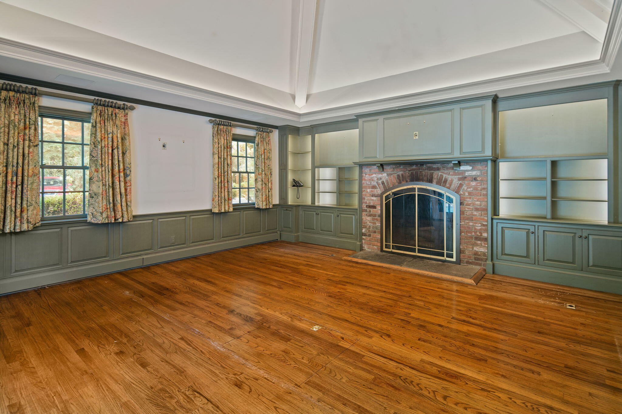 2061 Ponus Ridge Road New Canaan, CT 06840 - Photo 26 of 50 a view of empty room with fireplace and wooden floor
