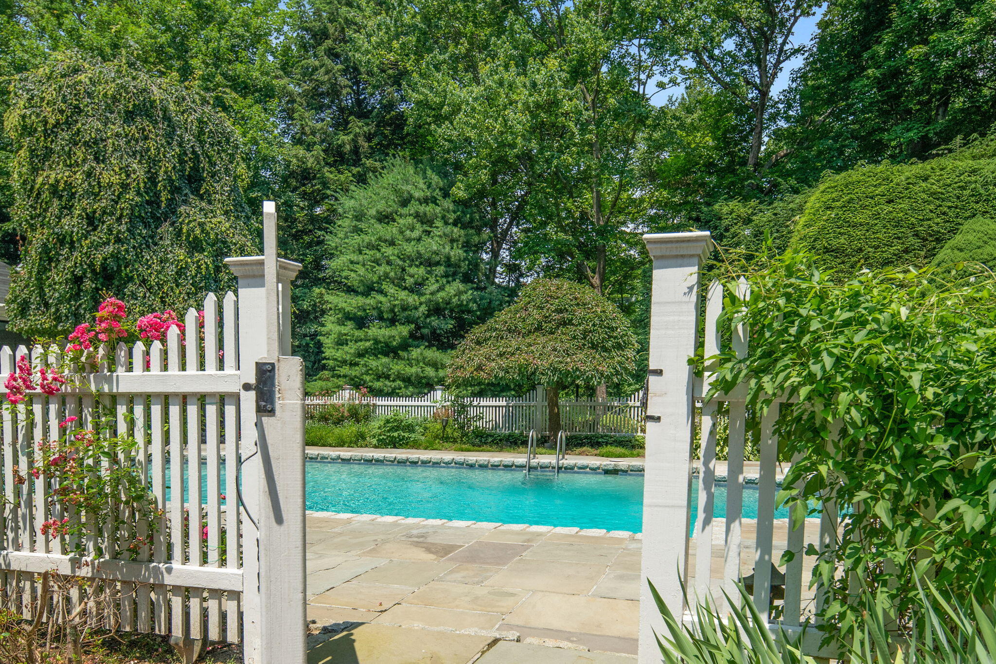 2061 Ponus Ridge Road New Canaan, CT 06840 - Photo 32 of 50 a view of green field with a tree and wooden fence