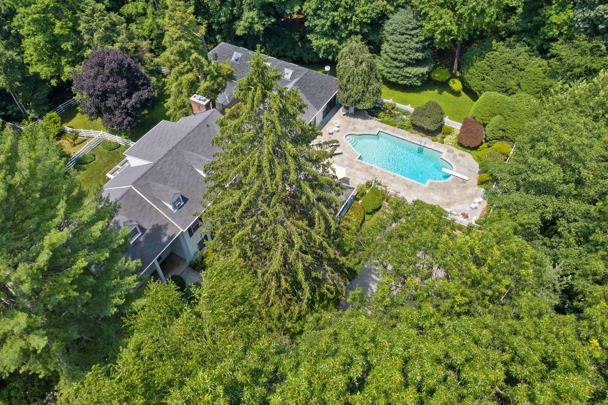 2061 Ponus Ridge Road New Canaan, CT 06840 - Photo 36 of 50 an aerial view of residential house with outdoor space and trees all around