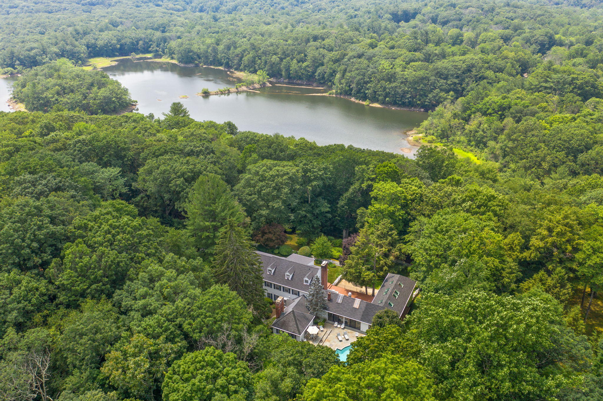 2061 Ponus Ridge Road New Canaan, CT 06840 - Photo 38 of 50 an aerial view of a house with a yard and lake view
