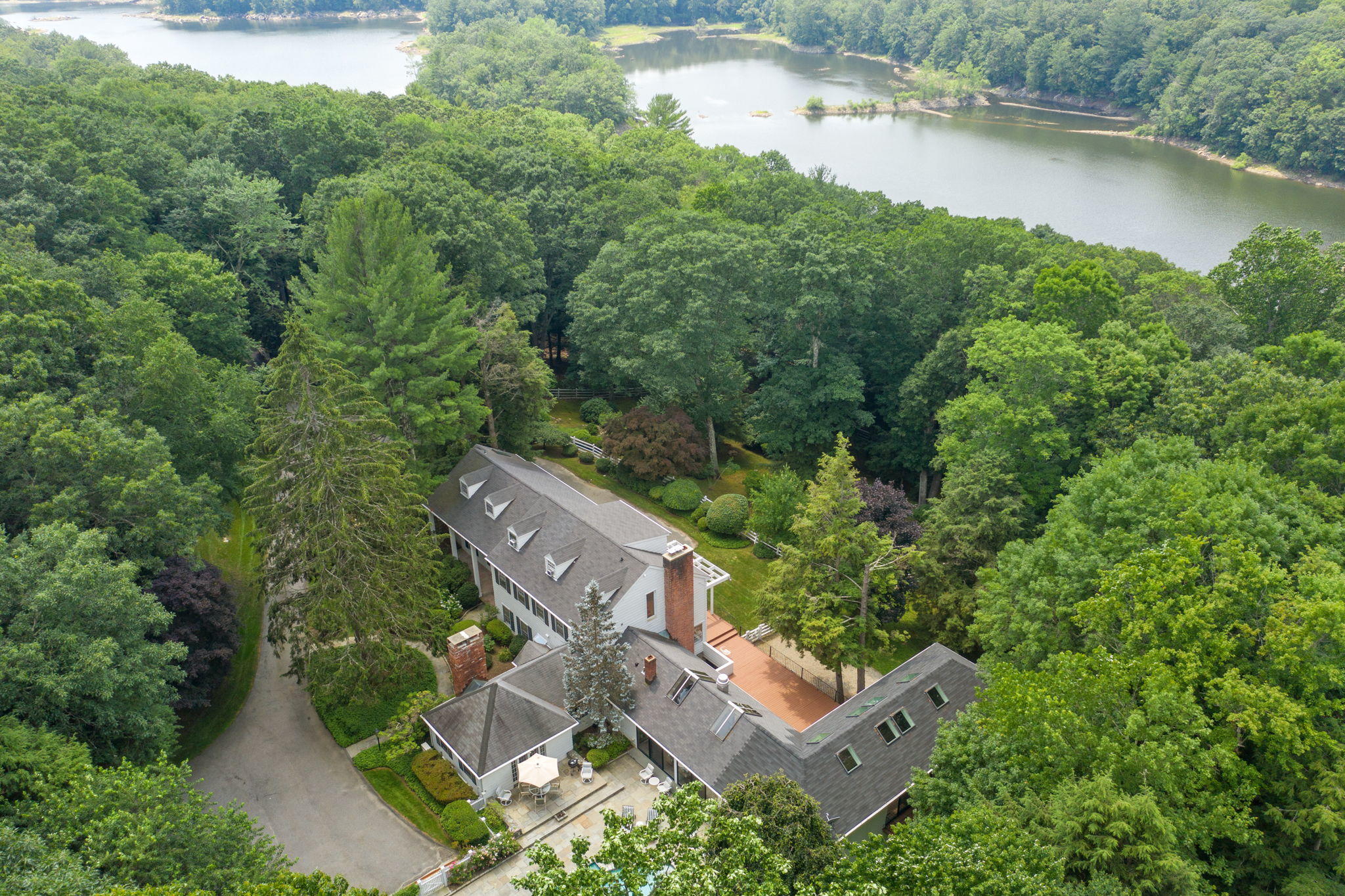 2061 Ponus Ridge Road New Canaan, CT 06840 - Photo 39 of 50 an aerial view of a house with a yard and lake view