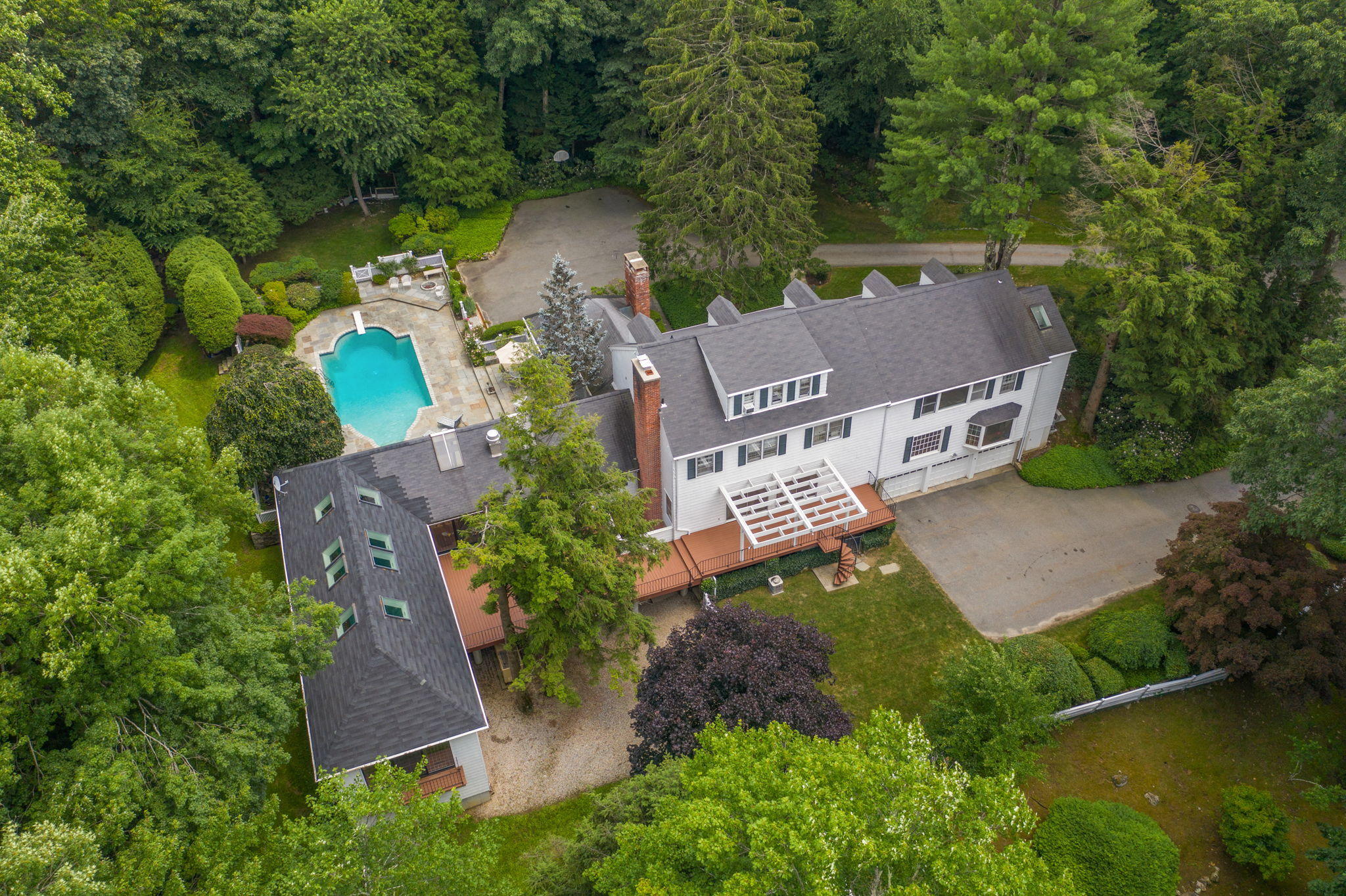 2061 Ponus Ridge Road New Canaan, CT 06840 - Photo 40 of 50 an aerial view of a house with garden space and a street view