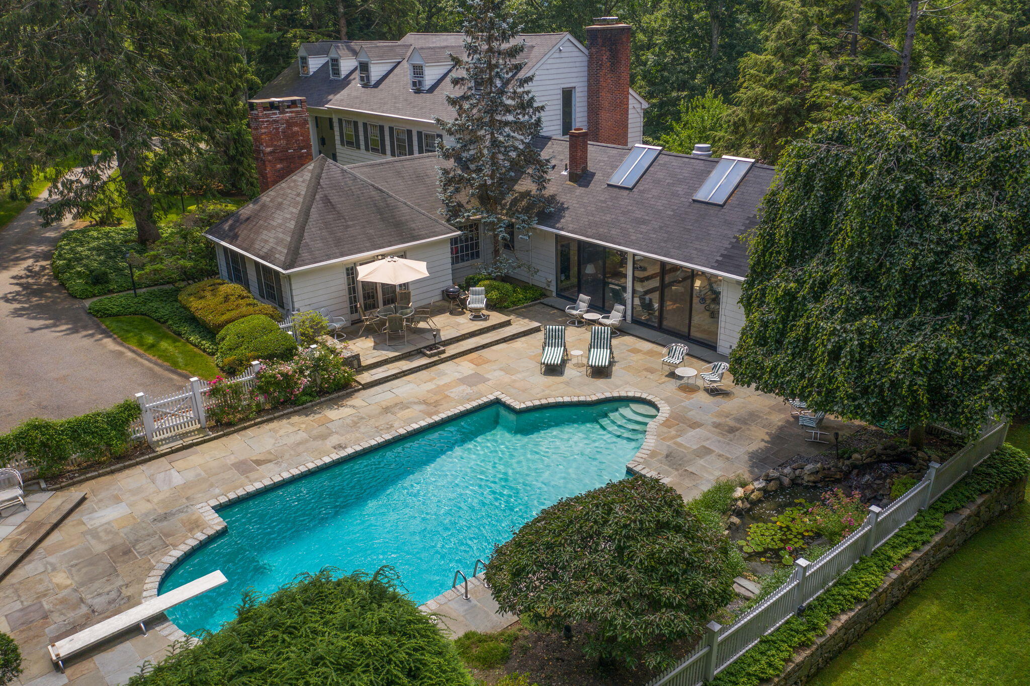 2061 Ponus Ridge Road New Canaan, CT 06840 - Photo 44 of 50 an aerial view of multiple houses with yard
