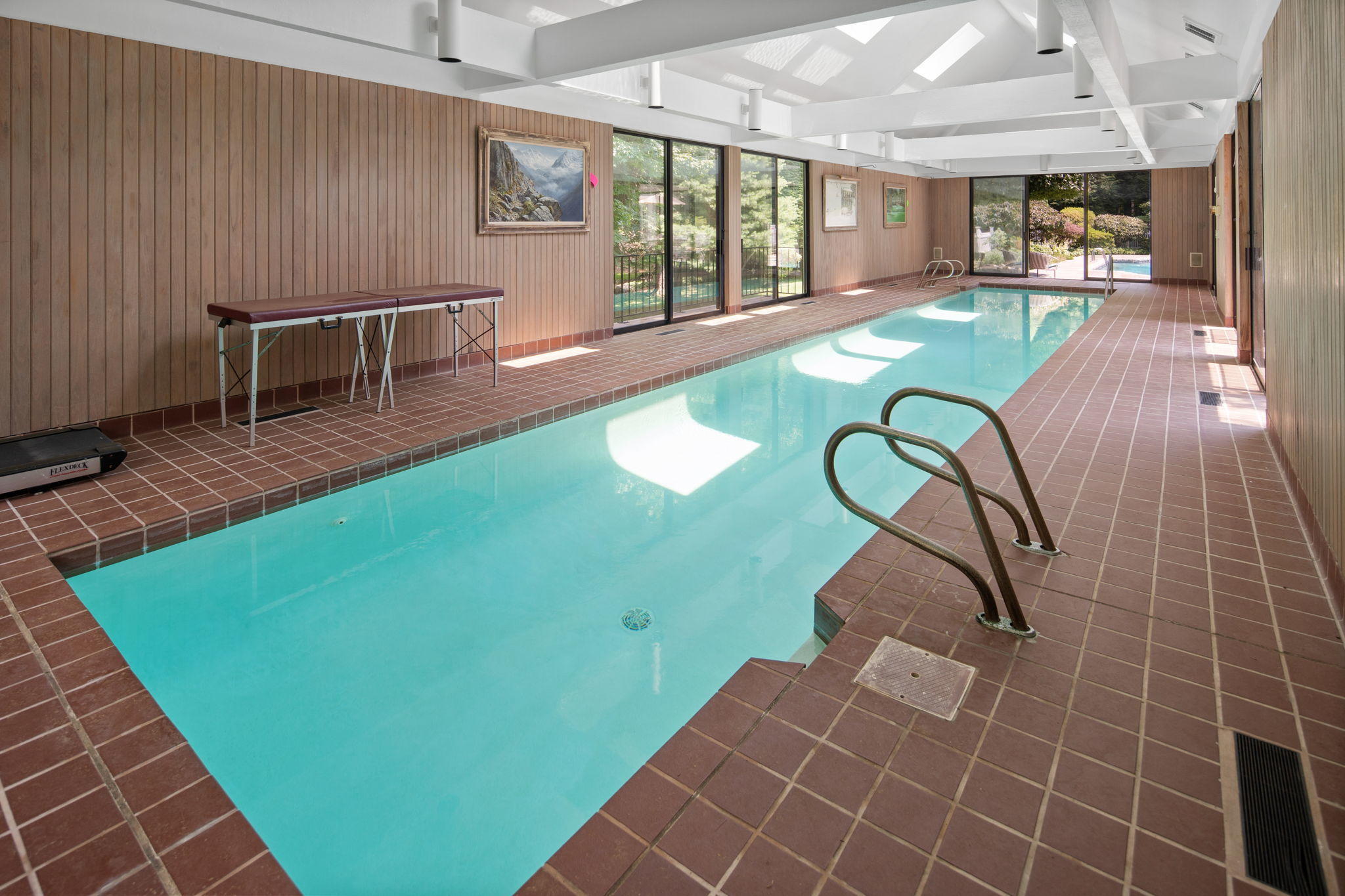 2061 Ponus Ridge Road New Canaan, CT 06840 - Photo 10 of 50 a view of swimming pool with a dining table chairs and a rug