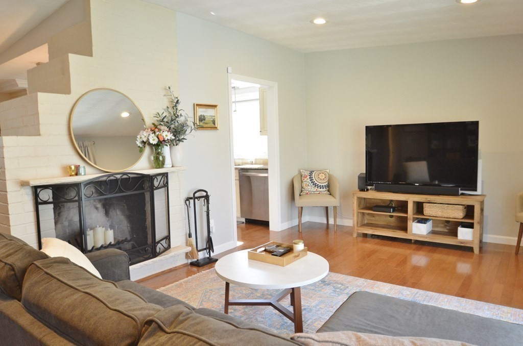 24 Raleigh Road Framingham, MA 01701 - Photo 12 of 37 a living room with furniture and a flat screen tv