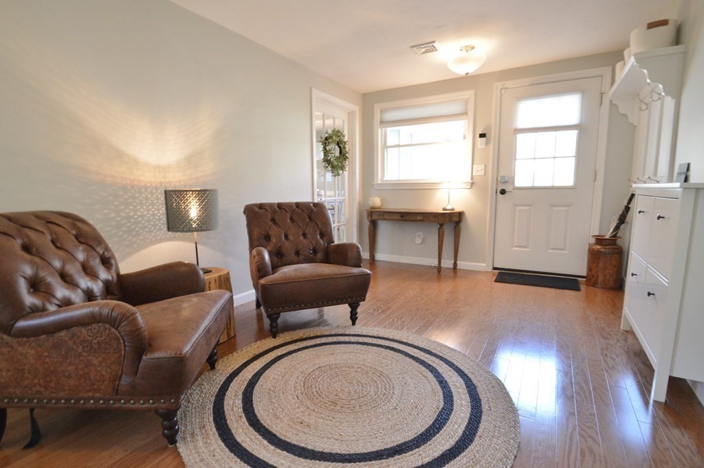 24 Raleigh Road Framingham, MA 01701 - Photo 19 of 37 a living room with furniture and a wooden floor