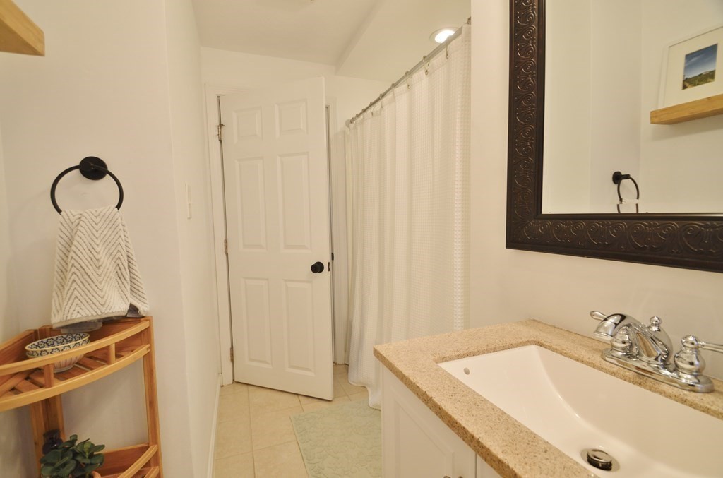 24 Raleigh Road Framingham, MA 01701 - Photo 21 of 37 a bathroom with a sink and a mirror