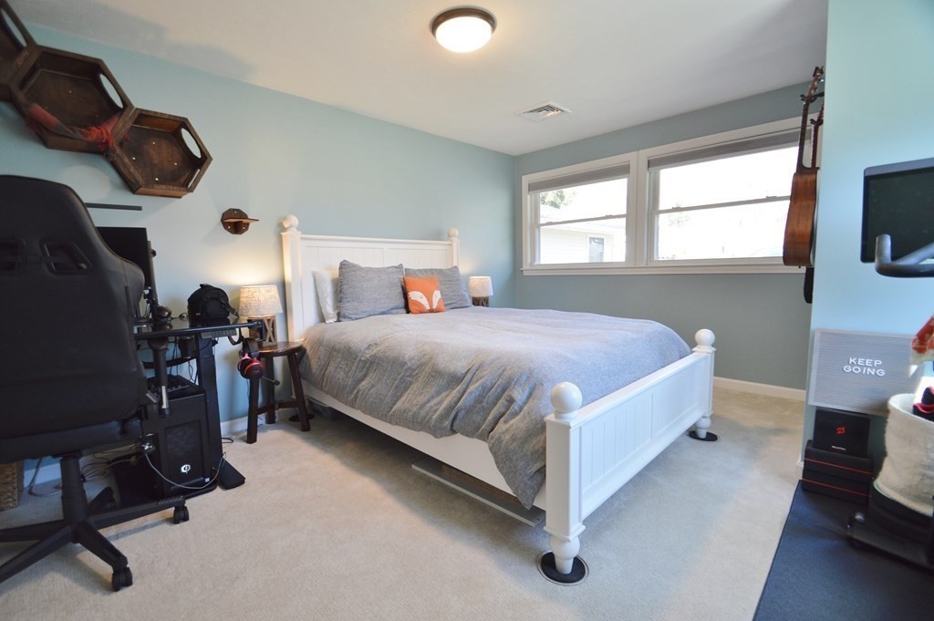 24 Raleigh Road Framingham, MA 01701 - Photo 23 of 37 a bedroom with a bed and a tv