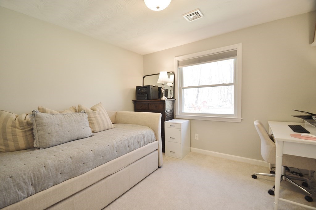 24 Raleigh Road Framingham, MA 01701 - Photo 25 of 37 a living room with a couch and a window
