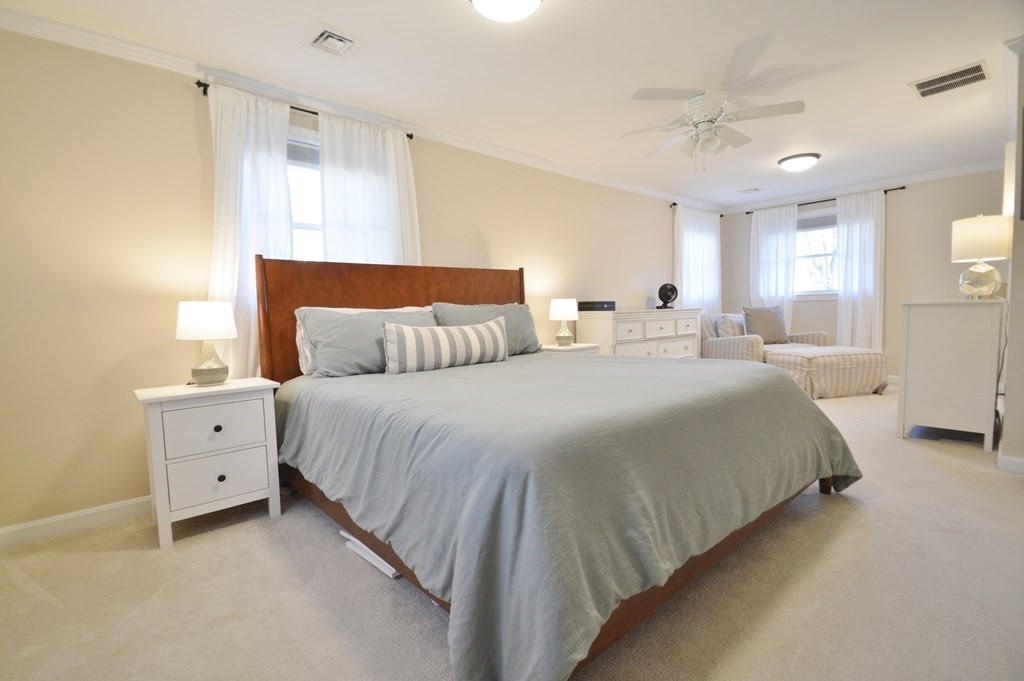 24 Raleigh Road Framingham, MA 01701 - Photo 29 of 37 a bedroom with a bed and a night stand