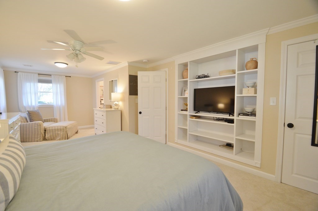 24 Raleigh Road Framingham, MA 01701 - Photo 30 of 37 a bedroom with a bed and a flat screen tv