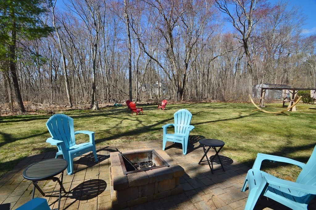 24 Raleigh Road Framingham, MA 01701 - Photo 36 of 37 a view of a backyard with table and chairs