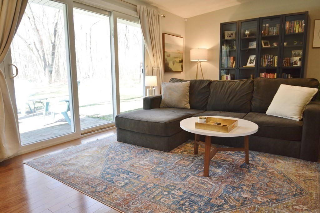 24 Raleigh Road Framingham, MA 01701 - Photo 10 of 37 a living room with furniture and a wooden floor