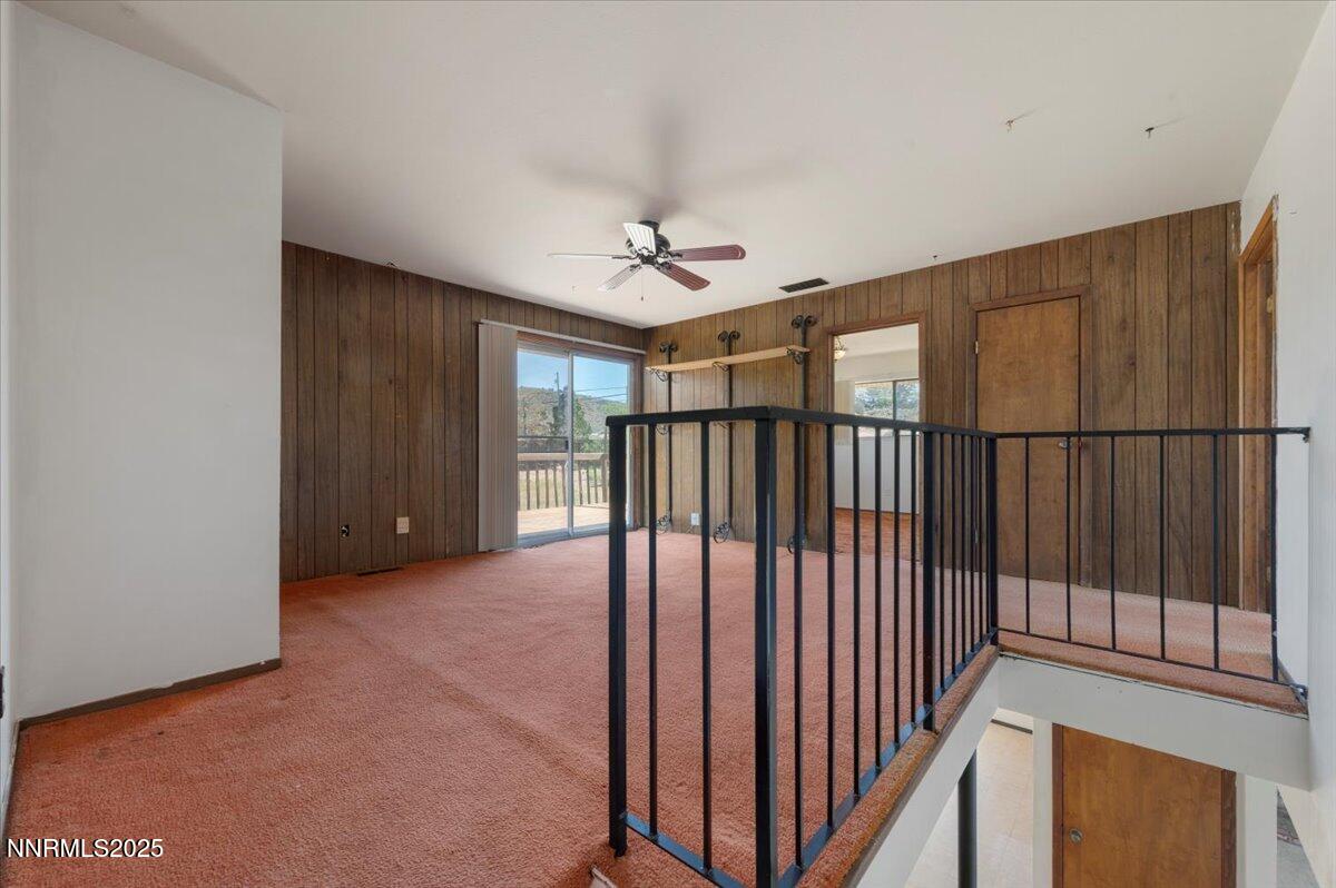 1190 Reese Way Reno, NV 89521 - Photo 12 of 25 a view of a hallway with a chandelier