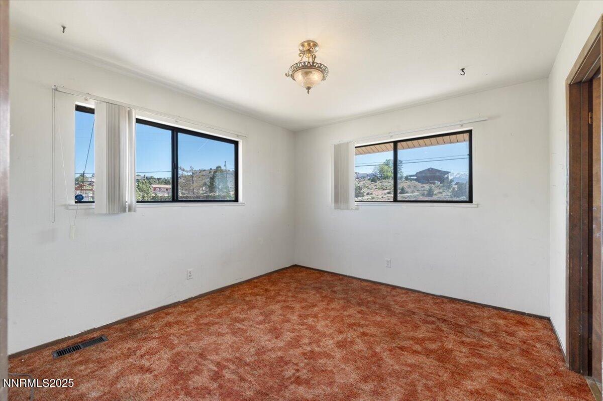1190 Reese Way Reno, NV 89521 - Photo 17 of 25 a view of empty room with wooden floor