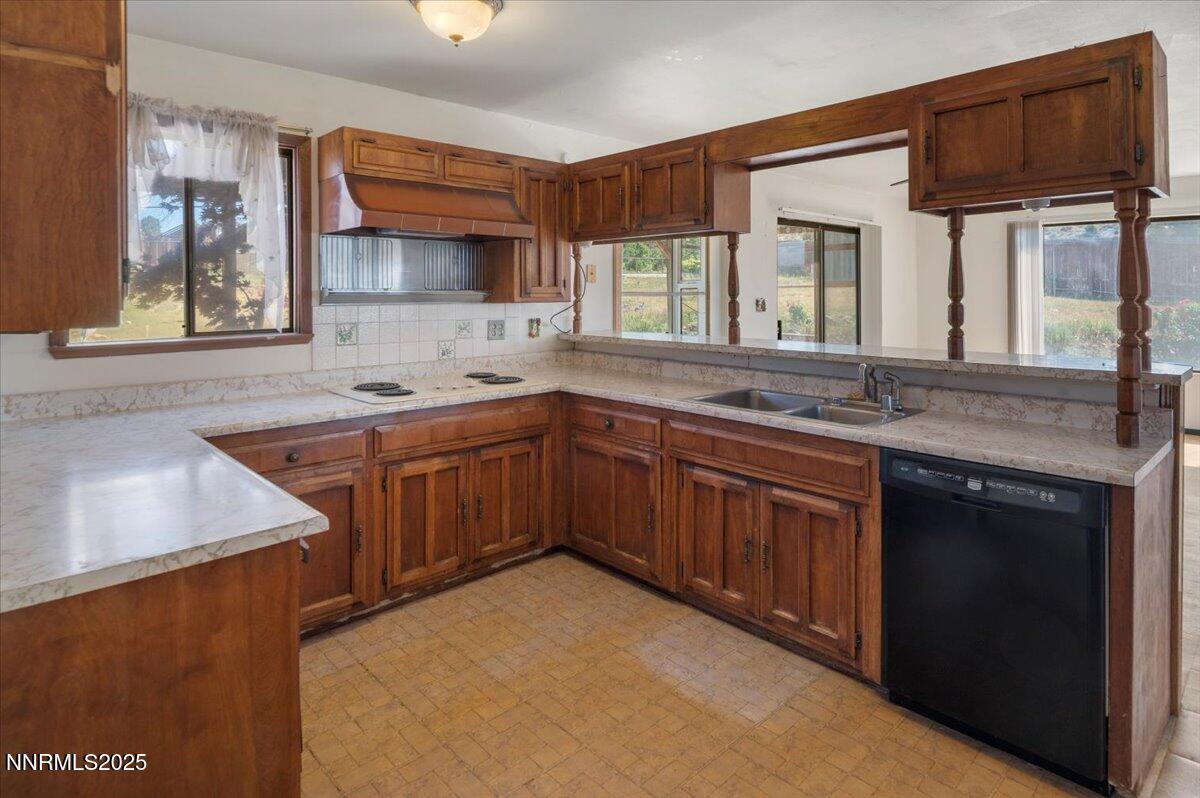 1190 Reese Way Reno, NV 89521 - Photo 8 of 25 a kitchen with stainless steel appliances granite countertop a sink stove and cabinets