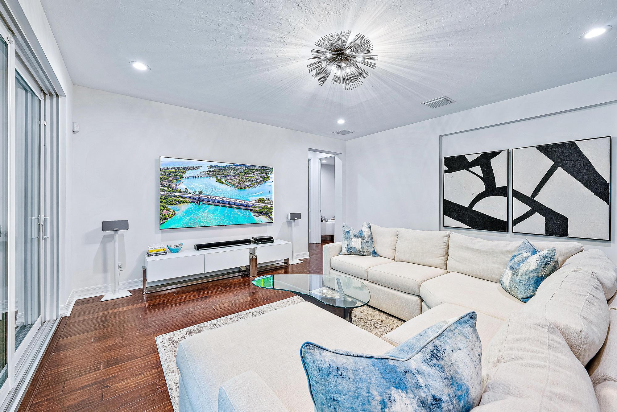 2702 West Mallory Boulevard Jupiter, FL 33458 - Photo 13 of 39 a living room with furniture and a flat screen tv