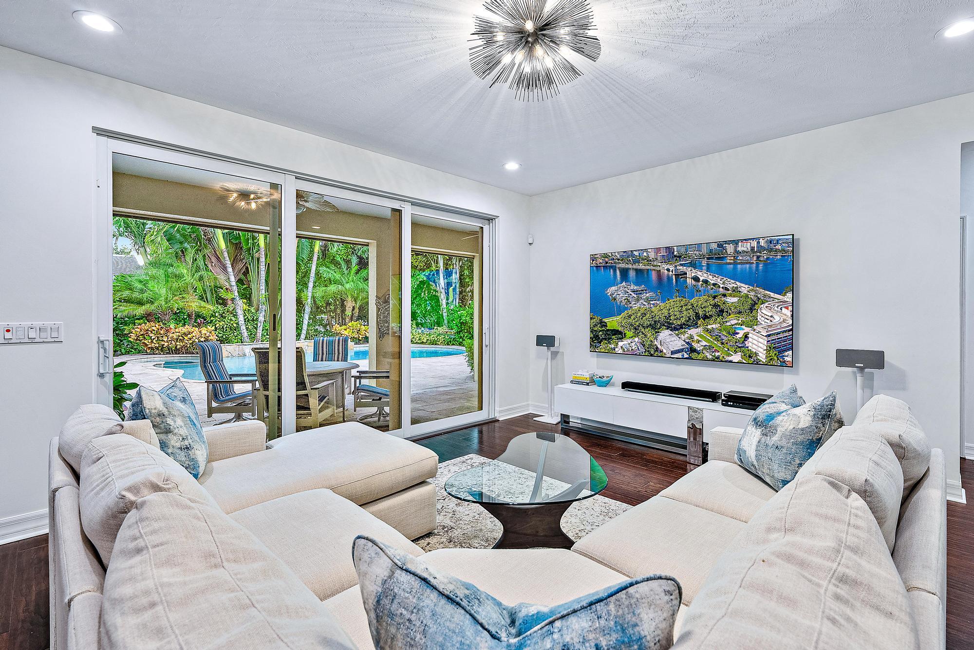 2702 West Mallory Boulevard Jupiter, FL 33458 - Photo 14 of 39 a living room with furniture and a flat screen tv