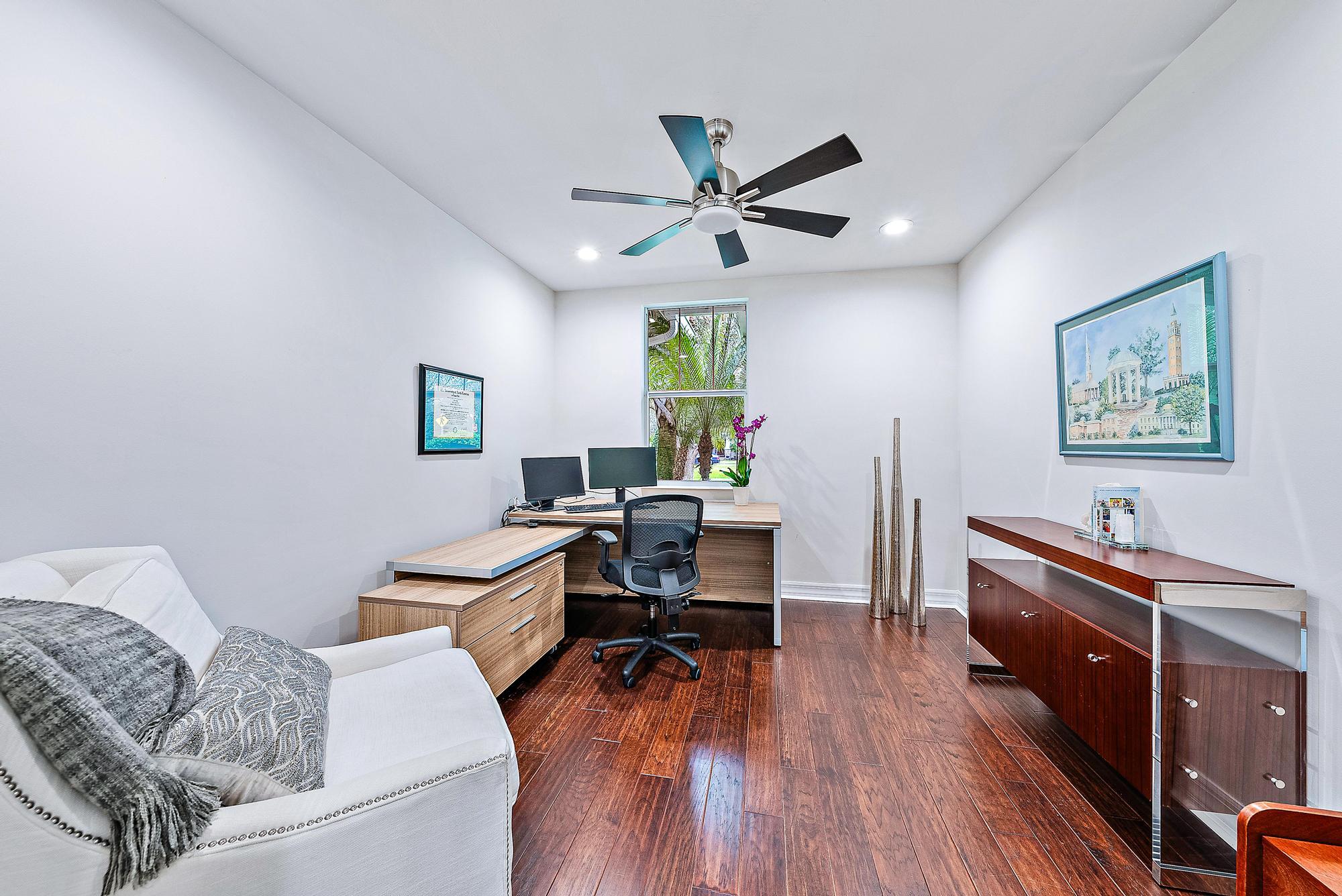 2702 West Mallory Boulevard Jupiter, FL 33458 - Photo 16 of 39 a living room with furniture and a wooden floor