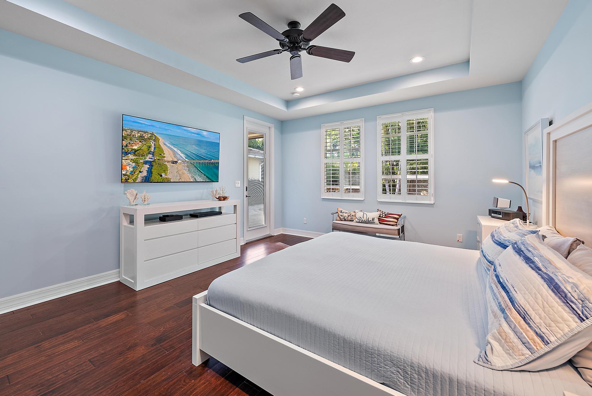 2702 West Mallory Boulevard Jupiter, FL 33458 - Photo 18 of 39 a room with a bed and a large window