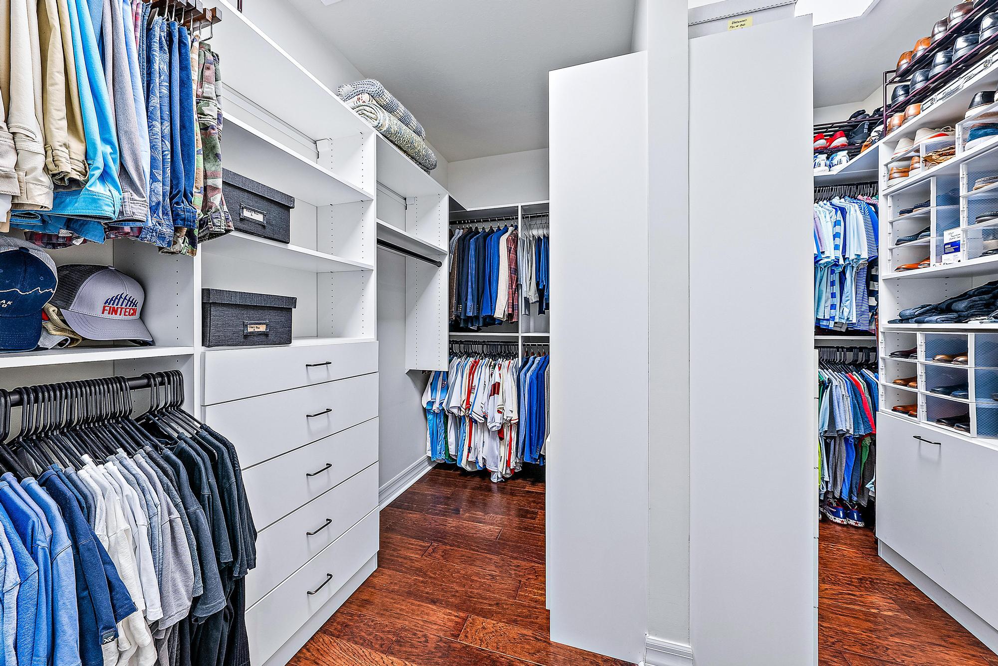 2702 West Mallory Boulevard Jupiter, FL 33458 - Photo 19 of 39 a view of walk in closet with clothes and shoes