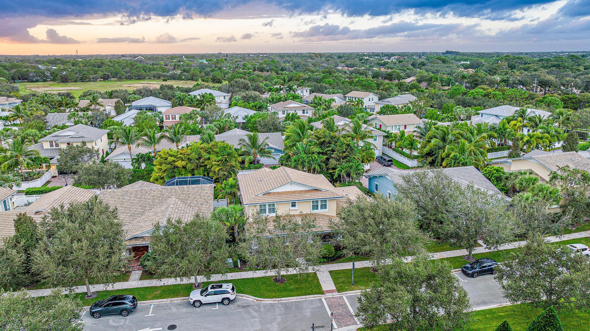 2702 West Mallory Boulevard Jupiter, FL 33458 - Photo 32 of 39 an aerial view of residential houses with outdoor space and street view