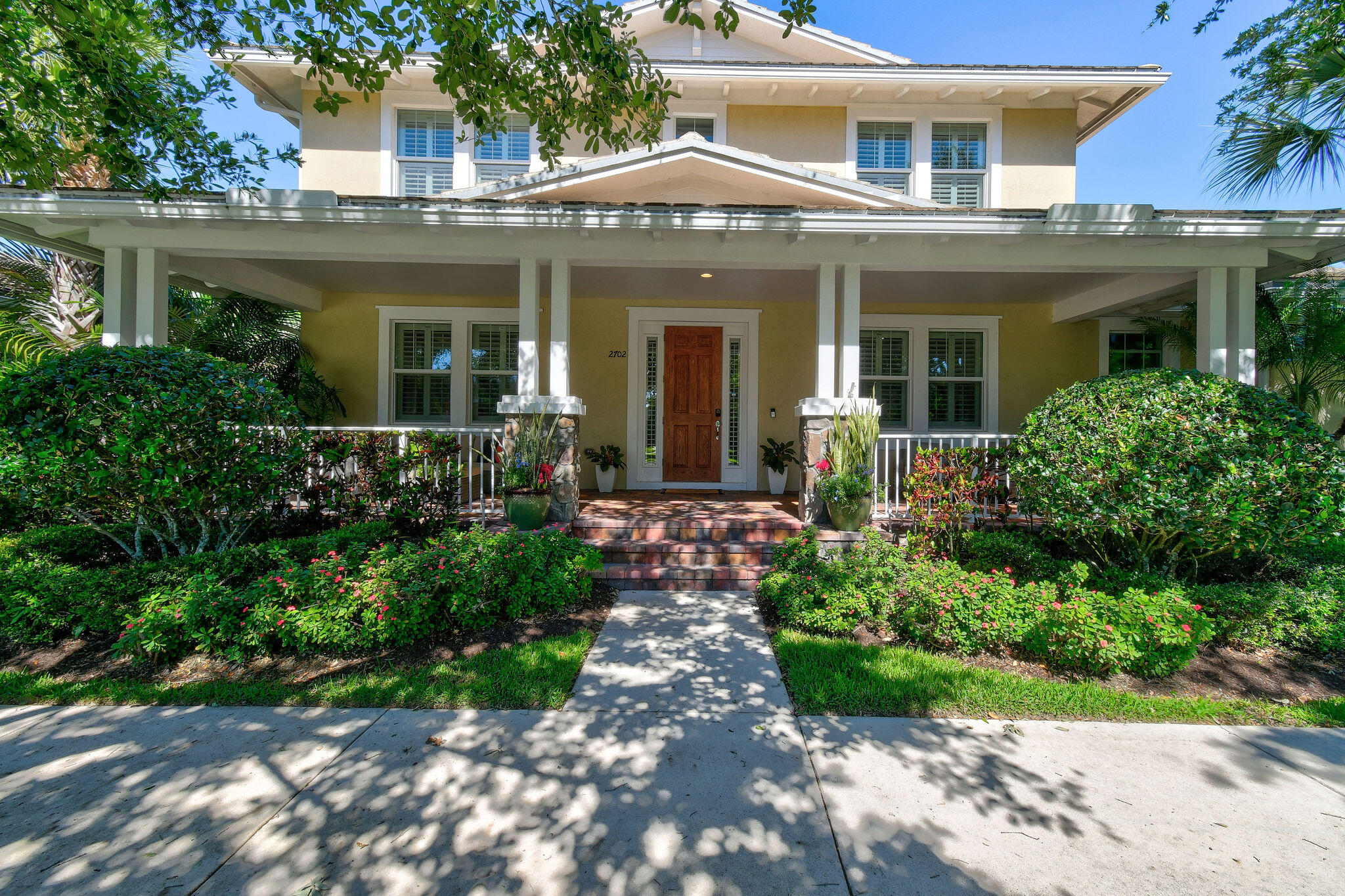 2702 West Mallory Boulevard Jupiter, FL 33458 - Photo 36 of 39 front view of a house with a yard