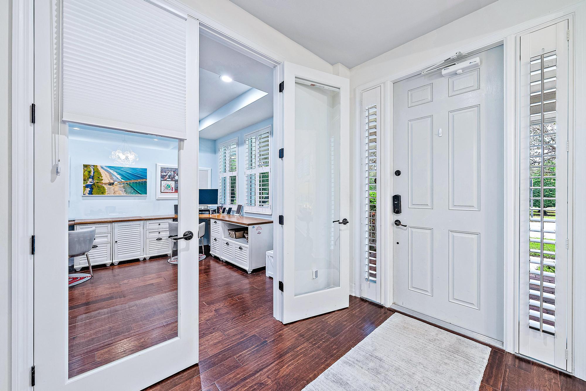 2702 West Mallory Boulevard Jupiter, FL 33458 - Photo 6 of 39 a view of living room filled with furniture and wooden floor