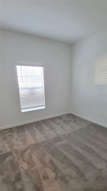 538 Hatteras Road Davenport, FL 33837 - Photo 13 of 29 an empty room with a window
