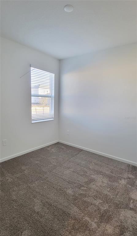 538 Hatteras Road Davenport, FL 33837 - Photo 14 of 29 an empty room with a window