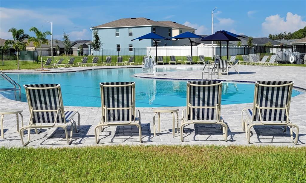 538 Hatteras Road Davenport, FL 33837 - Photo 26 of 29 a view of a chair and table in the patio