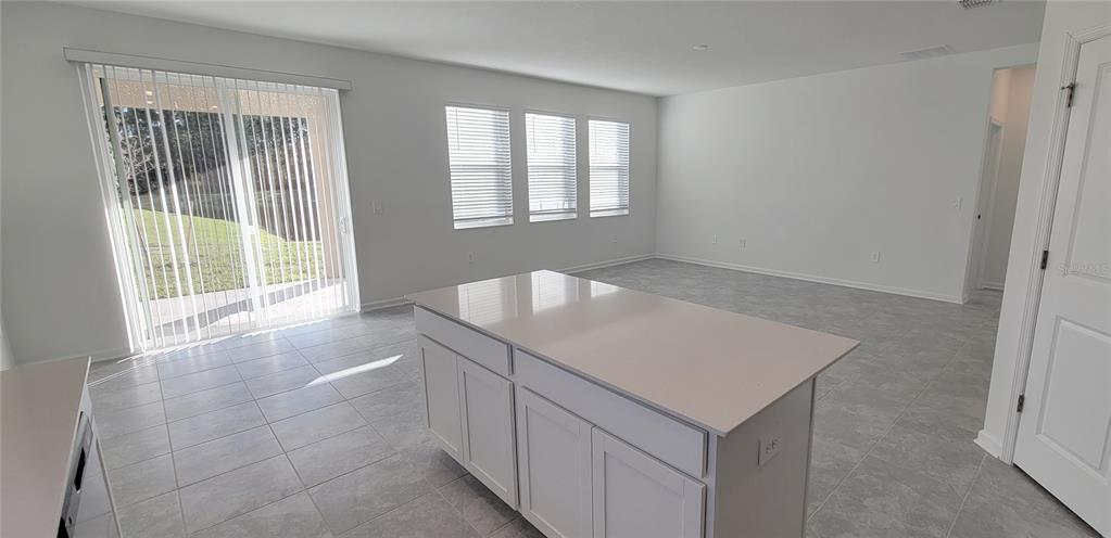 538 Hatteras Road Davenport, FL 33837 - Photo 5 of 29 an empty room with windows