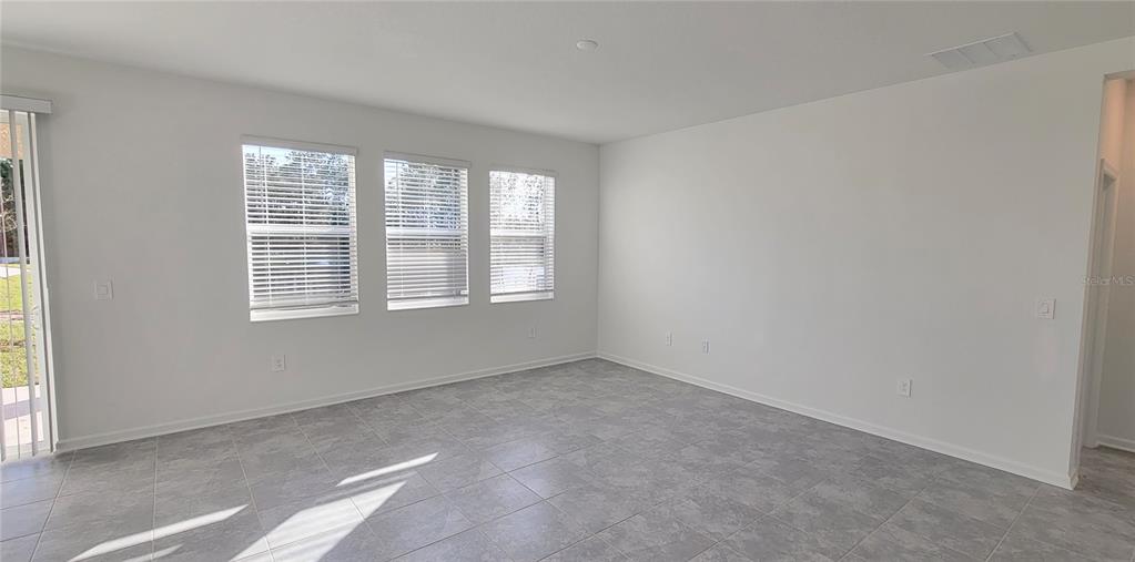 538 Hatteras Road Davenport, FL 33837 - Photo 6 of 29 a view of an empty room with a window