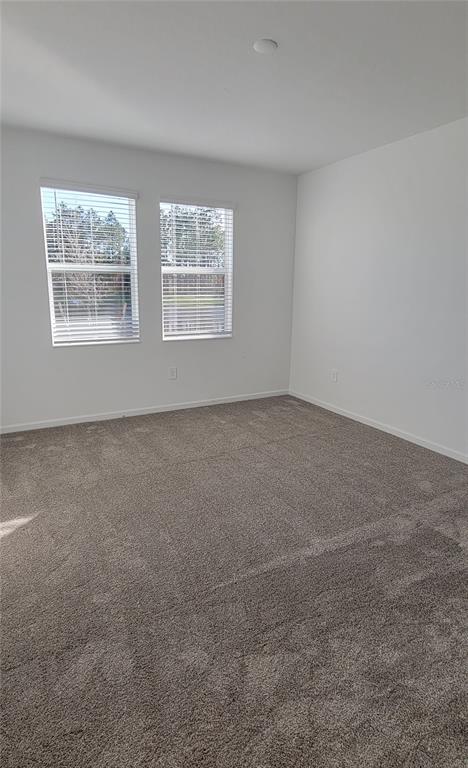 538 Hatteras Road Davenport, FL 33837 - Photo 7 of 29 an empty room with windows