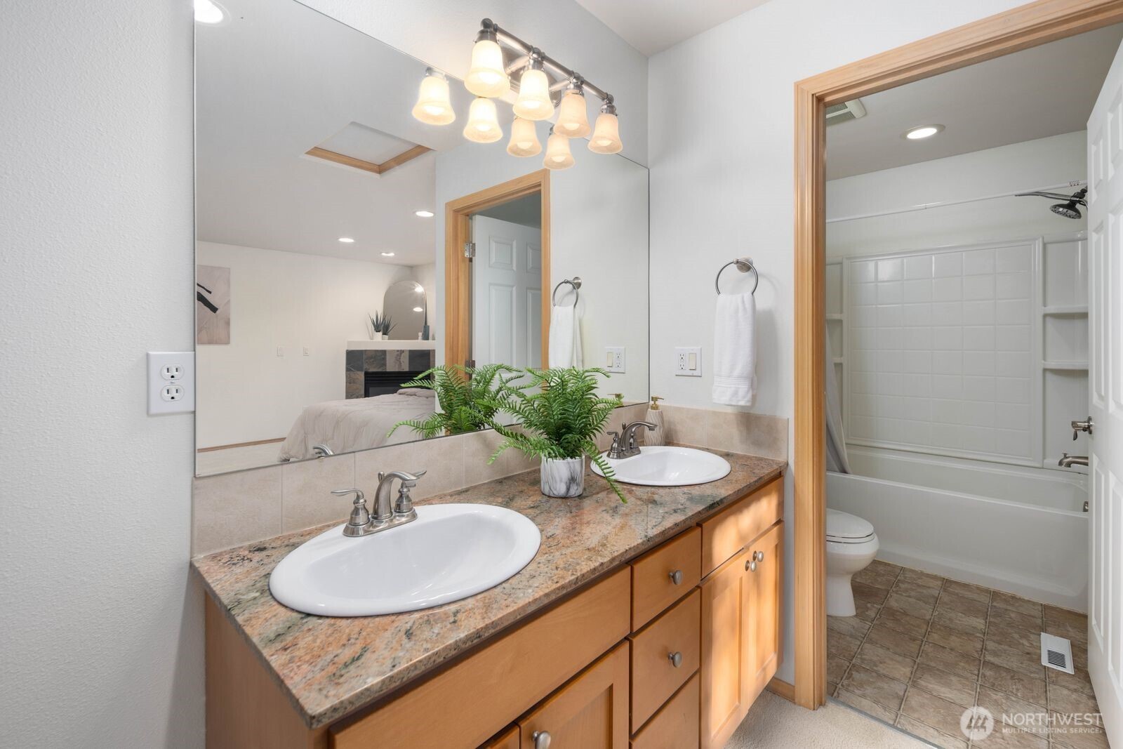 22217 Old Owen Road Monroe, WA 98272 - Photo 27 of 34 a bathroom with a sink double vanity granite tub and shower