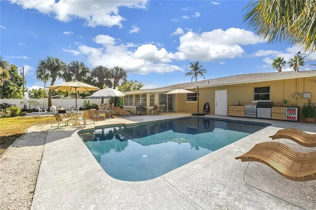 a view of a swimming pool with a patio