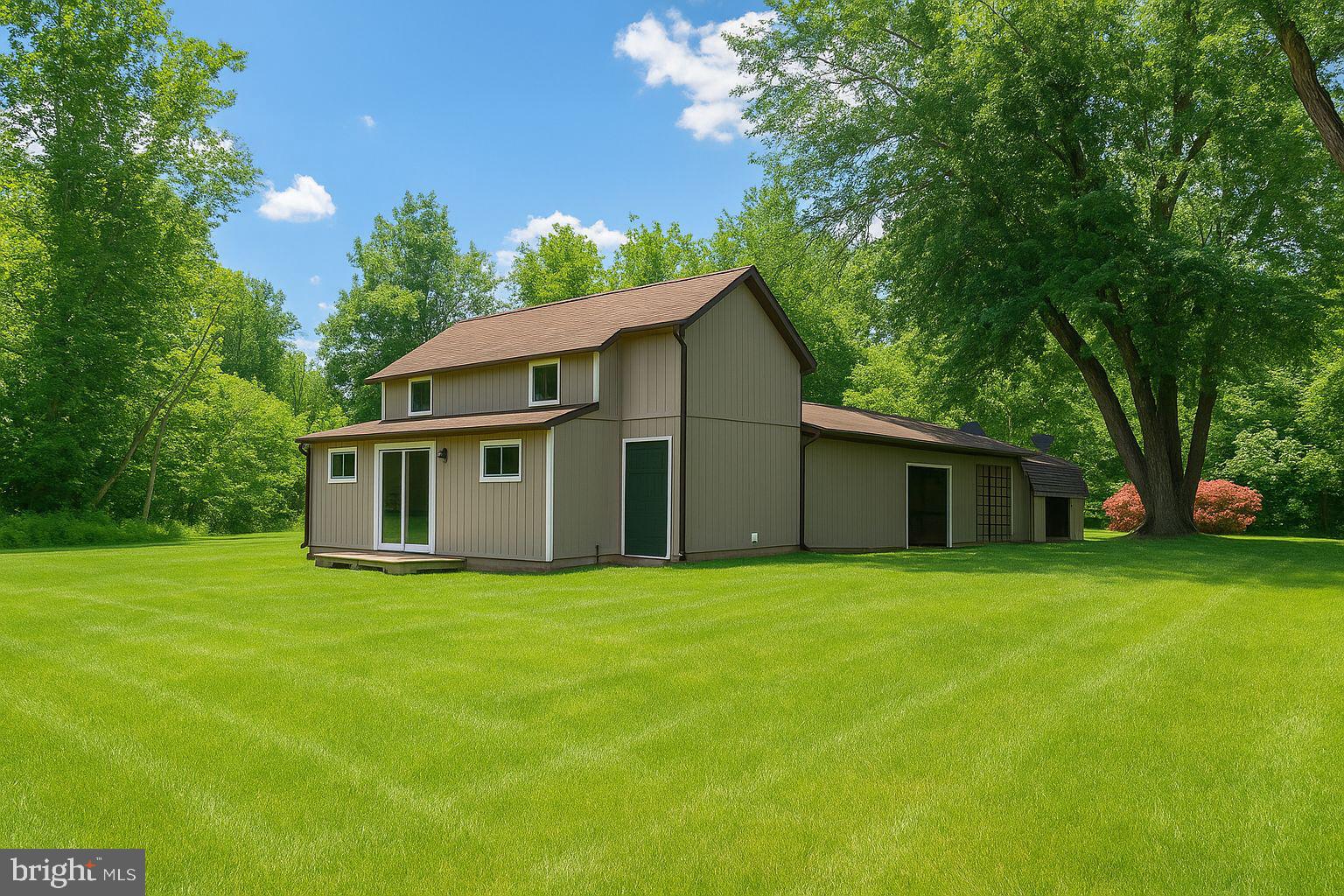 a view of a house with a big yard