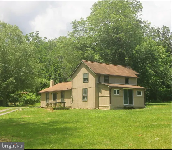 a front view of house with garden