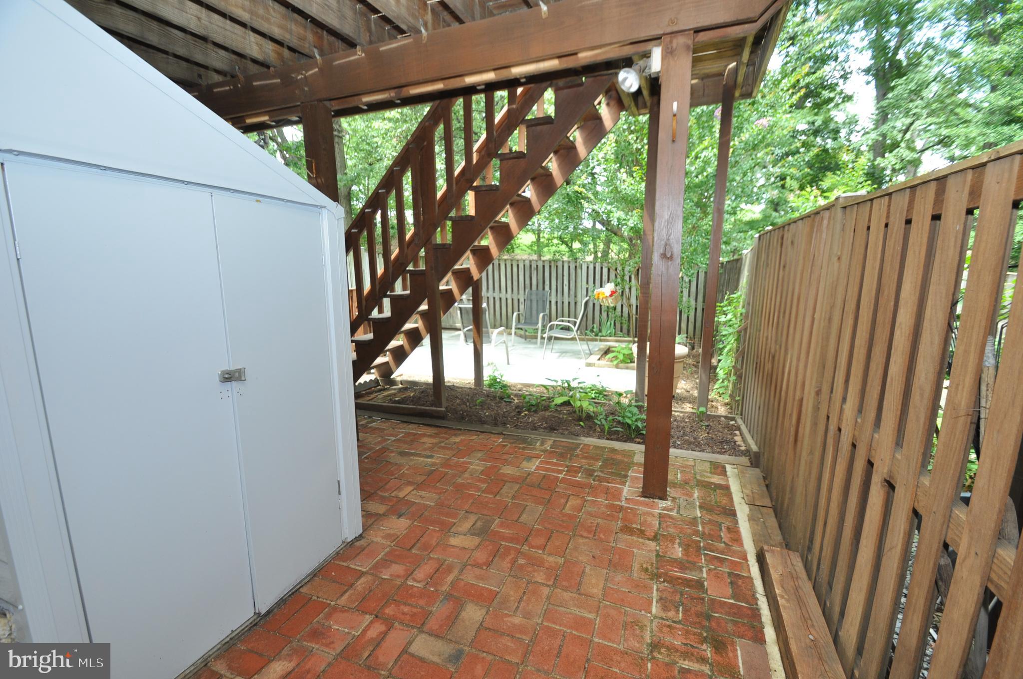 FAMILY ROOM OPENS TO BRICK PATIO & SHED