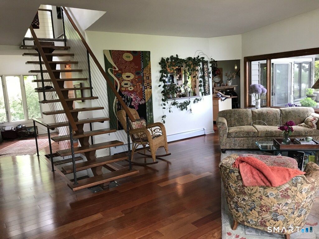 31 Splitrock Road Norwalk, CT 06854 - Photo 6 of 18 a living room with furniture and wooden floor