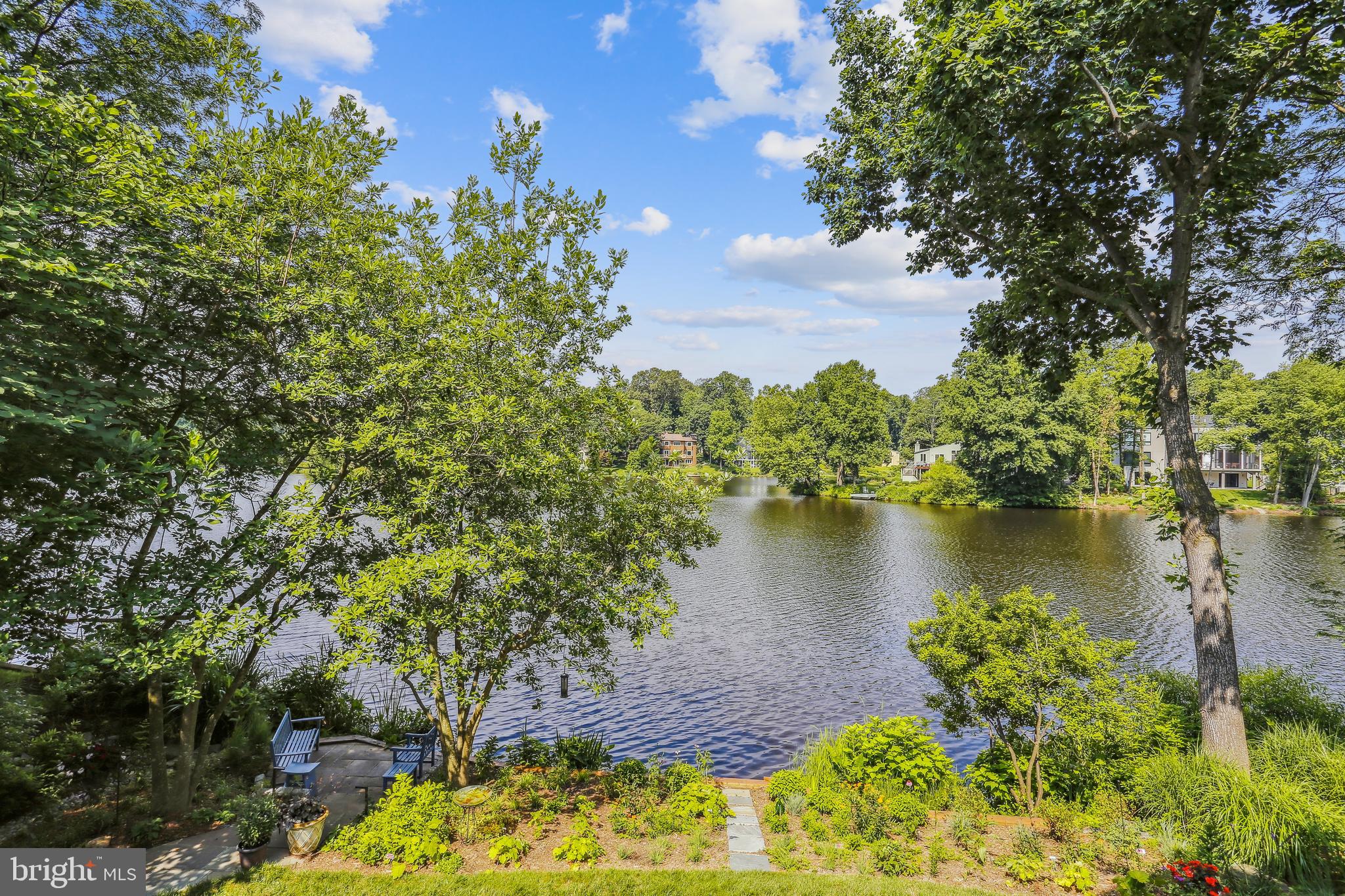 1480 Waterfront Road Reston, VA 20194 - Photo 3 of 65 a view of a lake with a garden