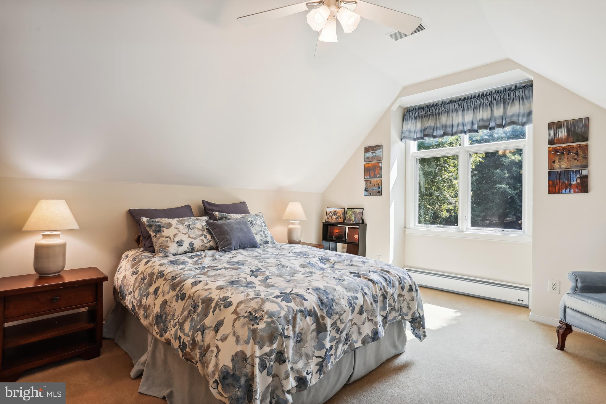 1480 Waterfront Road Reston, VA 20194 - Photo 39 of 65 a bedroom with a bed and a large window