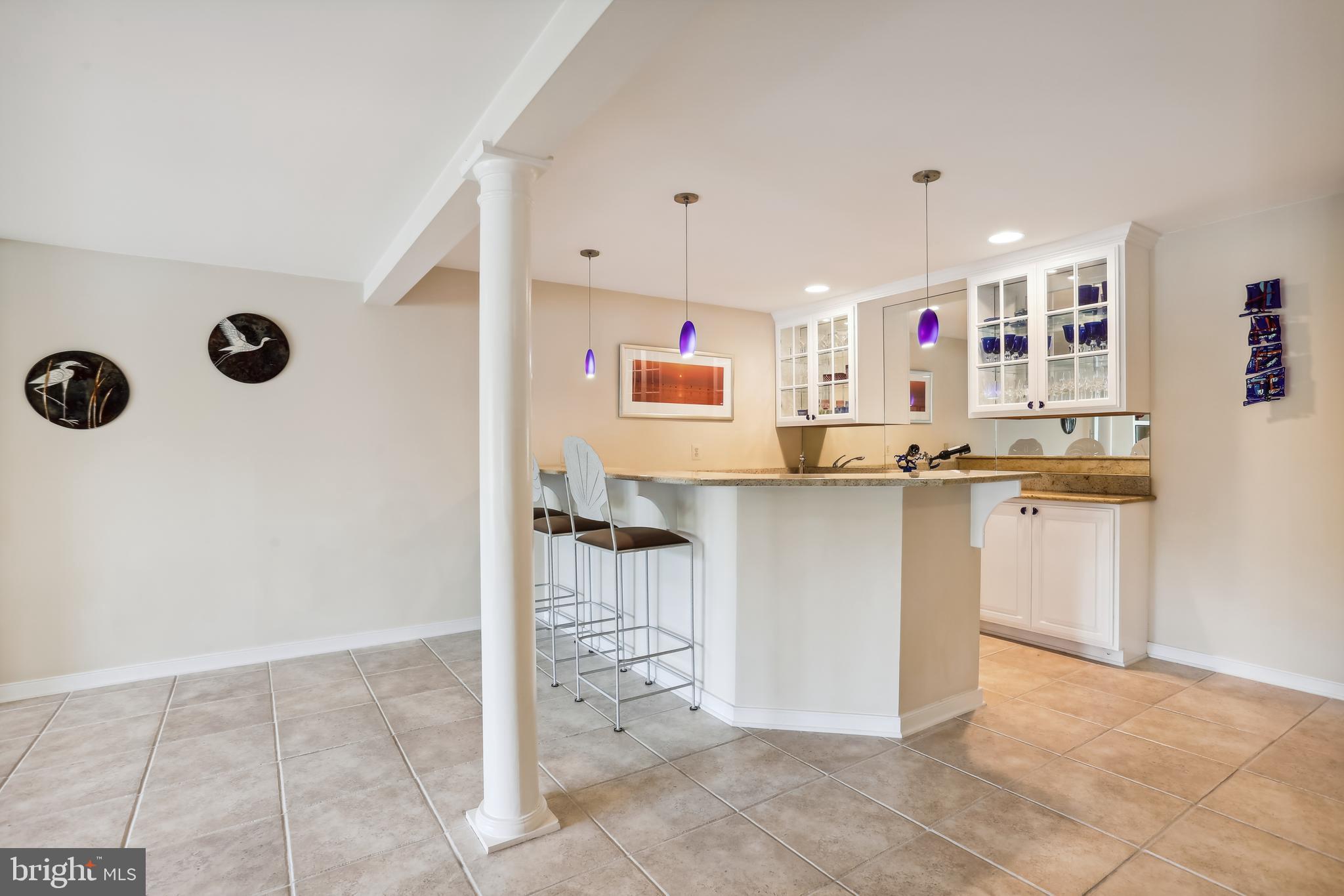 1480 Waterfront Road Reston, VA 20194 - Photo 50 of 65 a kitchen with granite countertop a sink and a stove