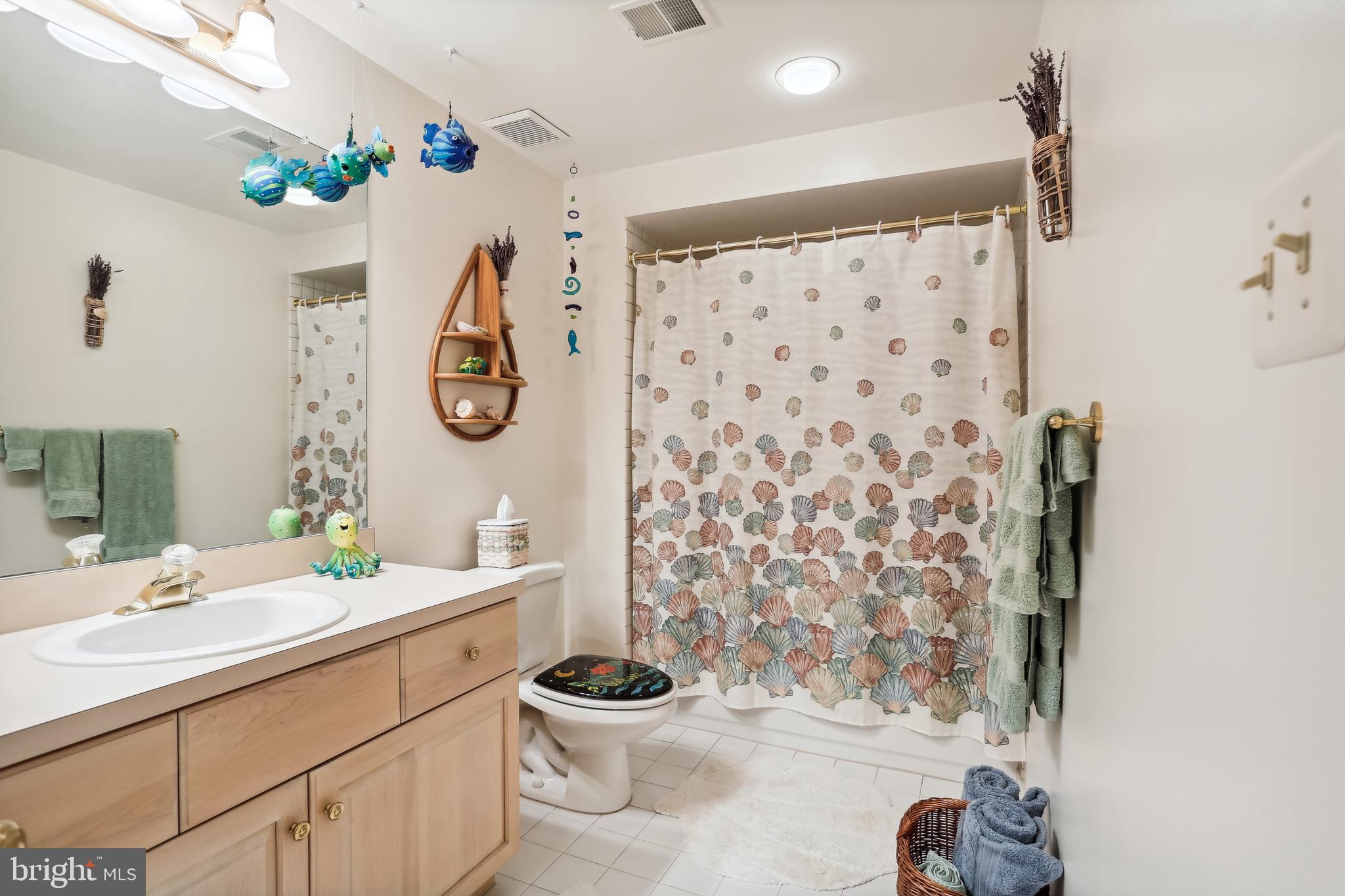 1480 Waterfront Road Reston, VA 20194 - Photo 53 of 65 a bathroom with a sink toilet and shower