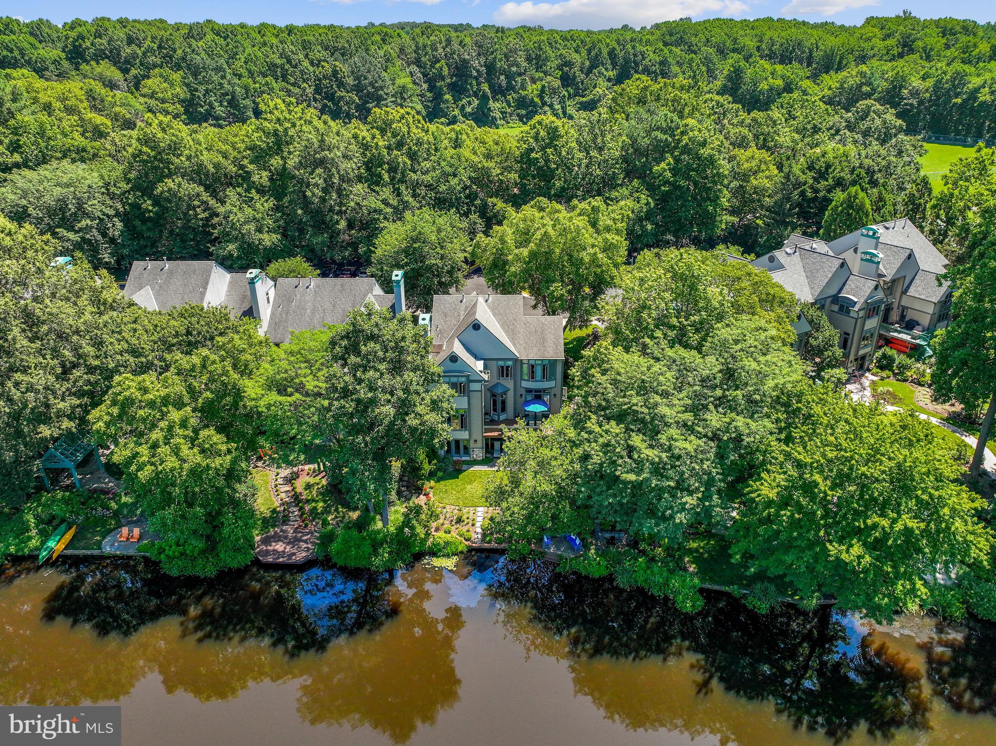 1480 Waterfront Road Reston, VA 20194 - Photo 64 of 65 a aerial view of a house with a yard and lake view