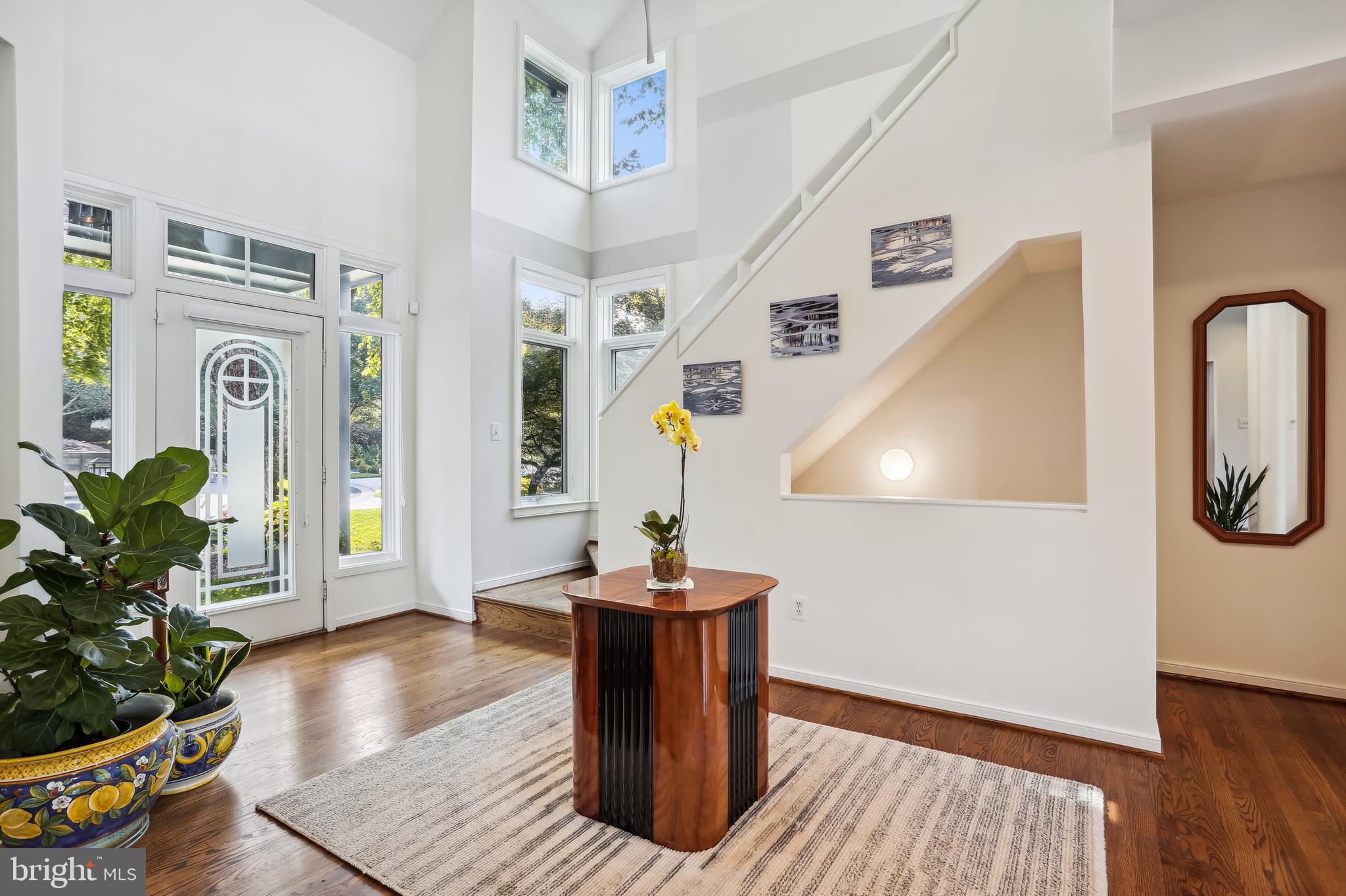 1480 Waterfront Road Reston, VA 20194 - Photo 7 of 65 a living room with furniture and a potted plant