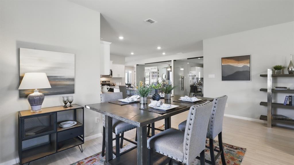16449 Hudson Pr Way Justin, TX 76247 - Photo 9 of 35 a view of a dining room with furniture