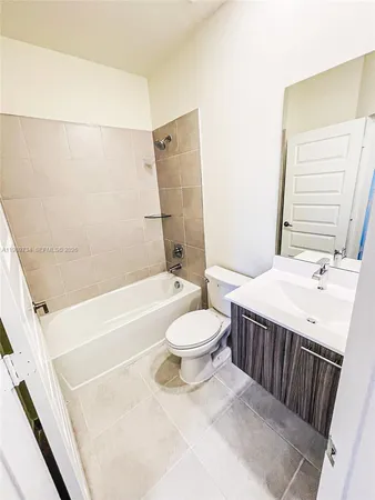 a bathroom with a sink a toilet and a bathtub